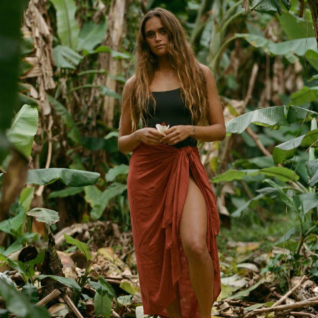 Clay red sarong editorial styling — Spa Mama Maui beach wrap