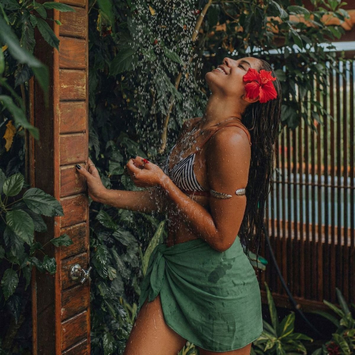 Olive green sarong at an outdoor shower — Spa Mama Maui